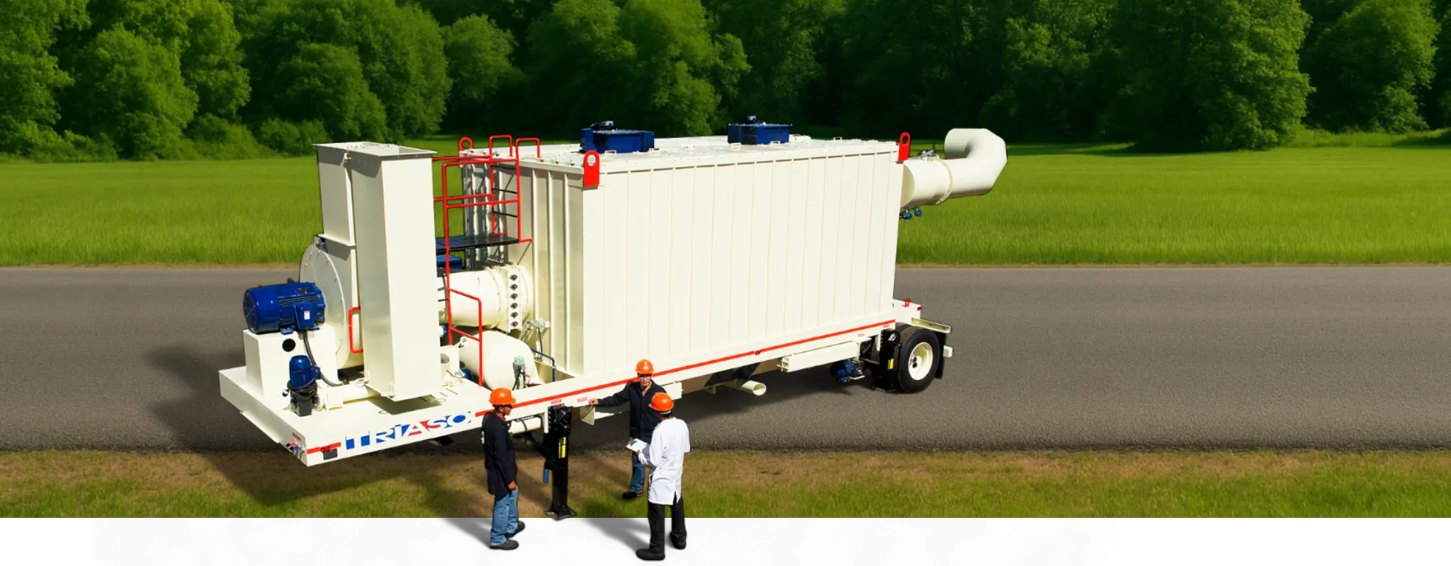 Bag house with a road in the background and workers next to it