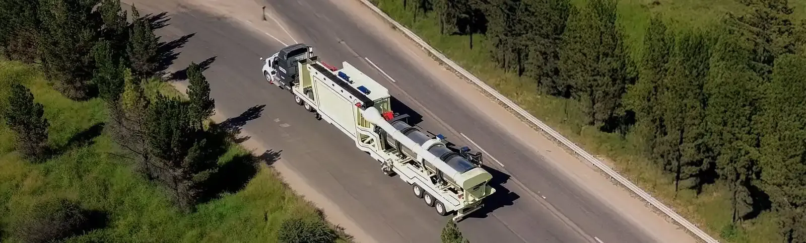 Truck with an asphalt plant on the road